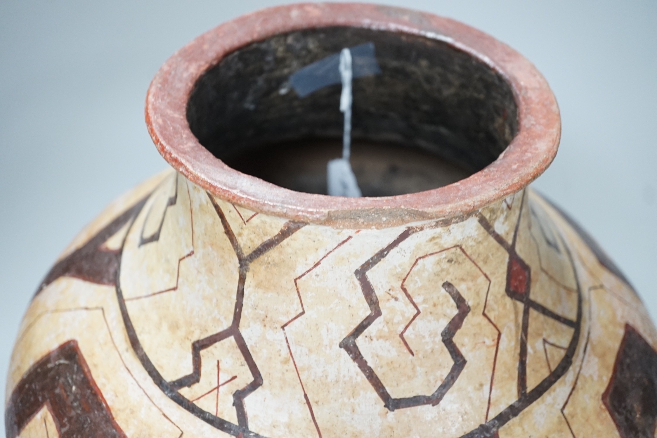 A Shipibo pottery water vessel with geometric pattern, Peru, 26cm tall